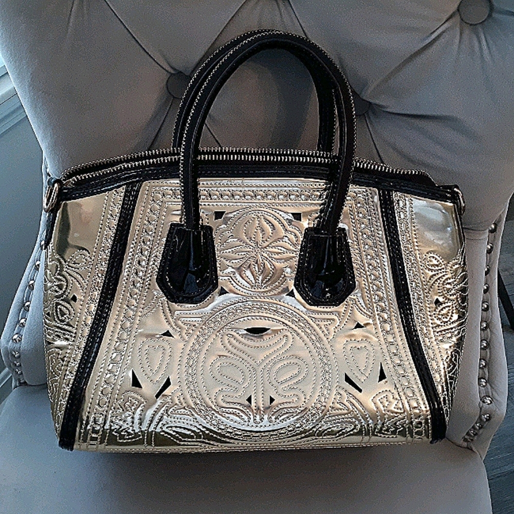 Gold and black patent handbag